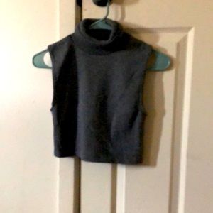 It’s a grey XL turtle neck with a long sleeve cut out